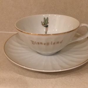 Two Disneyland tea cups and saucers.